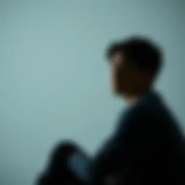 Person looking distressed and contemplative Individual sitting alone with a worried expression, symbolizing the struggle with anger and mental illness