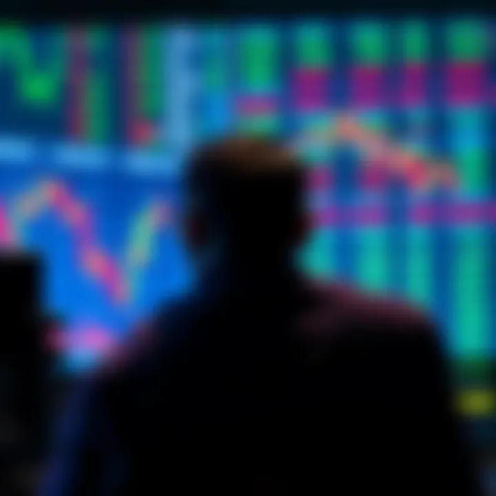 A worried trader looks at a chart showing market downturn in front of a computer screen filled with financial data.