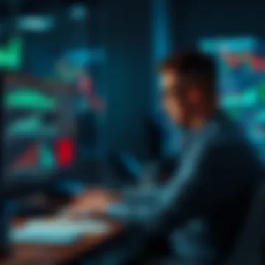 A trader sitting at a desk looking thoughtful with charts and graphs on their computer screen, showing a downward trend.